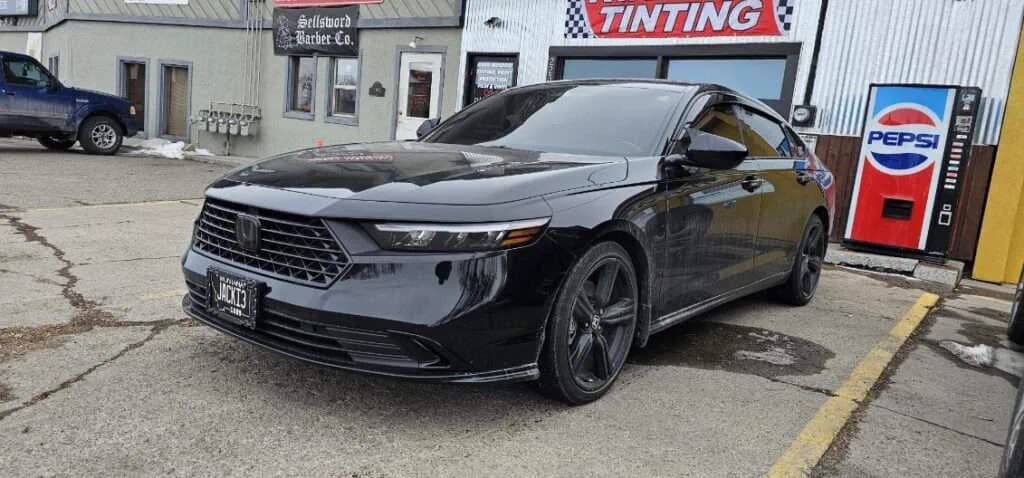 Black sedan parked outside Black Dog Tinting
