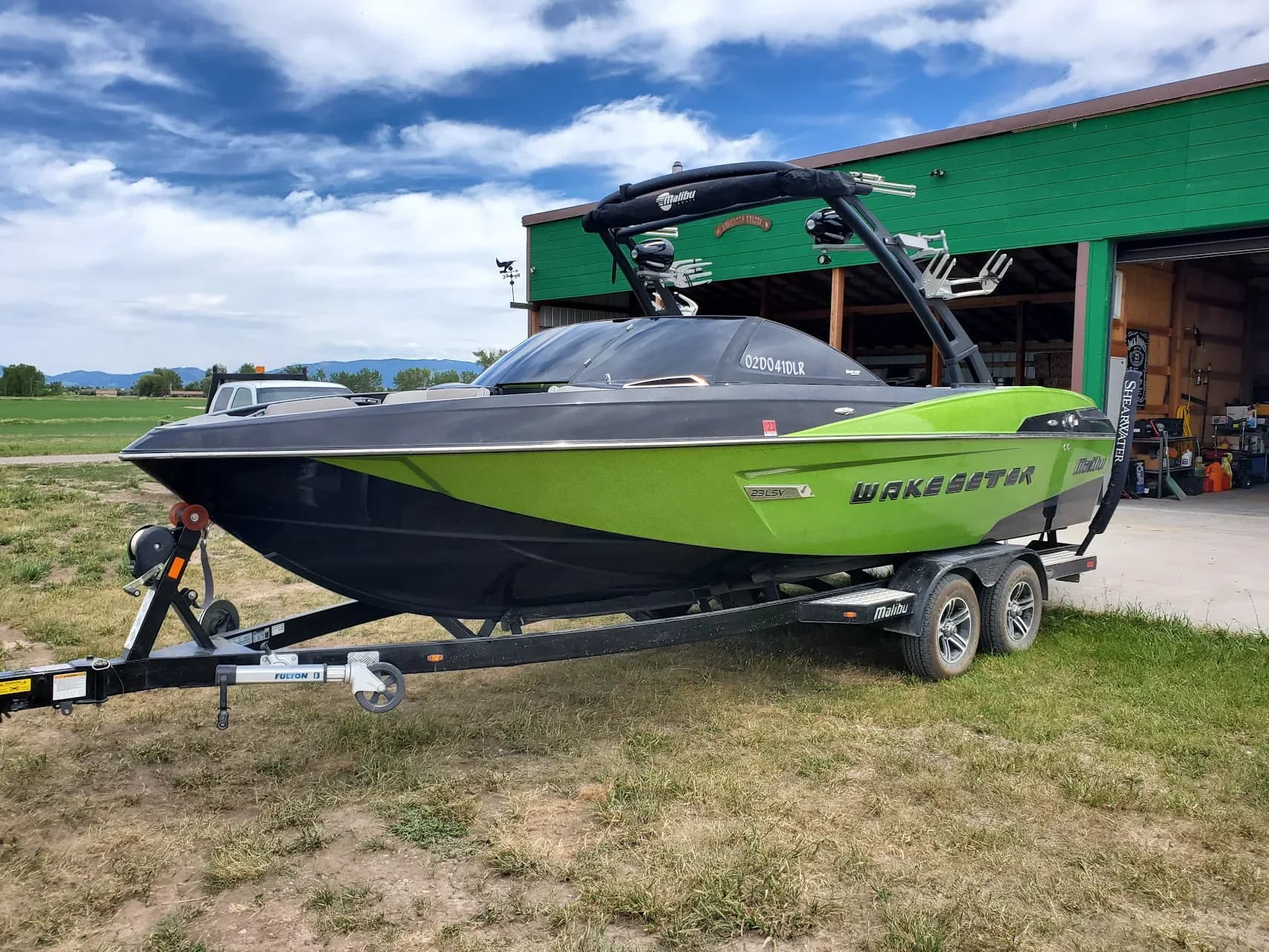 Green boat with tinted windshield glass