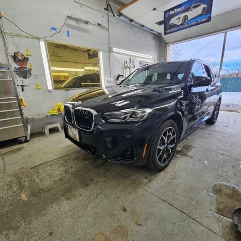Black BMW SUV in the installation bay